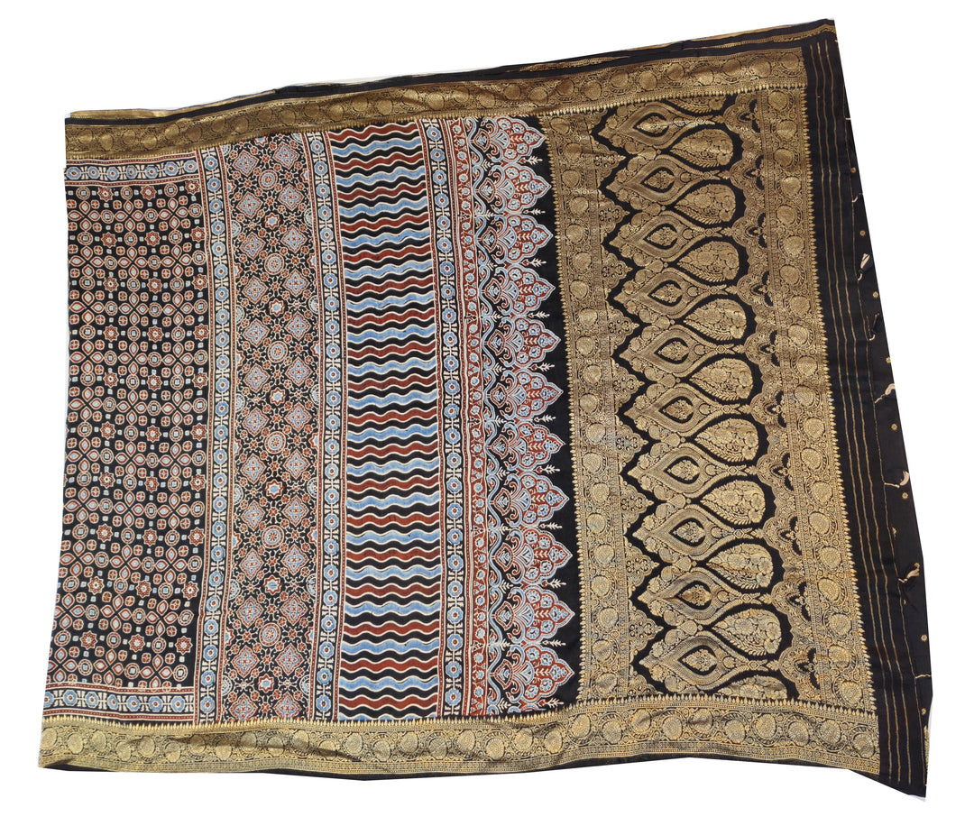 Dola silk saree in black with small motifs  and a contrast pallu in hand block Ajrakh print