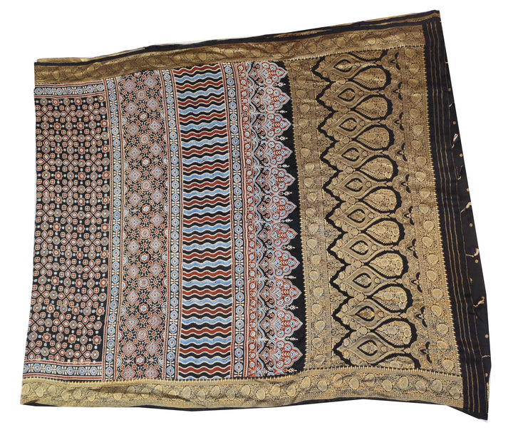 Dola silk saree in black with small motifs  and a contrast pallu in hand block Ajrakh print