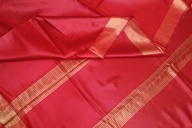 Handwoven Eri pure silk saree in red with  striped pallu.