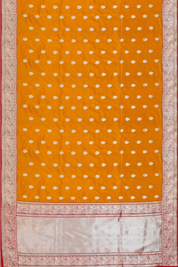 Handloom Banarasi katan pure silk saree in mustard colour with floral motifs