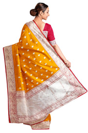 Handloom Banarasi katan pure silk saree in mustard colour with floral motifs