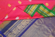 Gadwal pure silk saree in pink with gold & silver  motifs on the body and a rich contrast pallu .