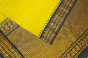 Gadwal pure silk saree in yellow  with gold & silver  motifs on the body