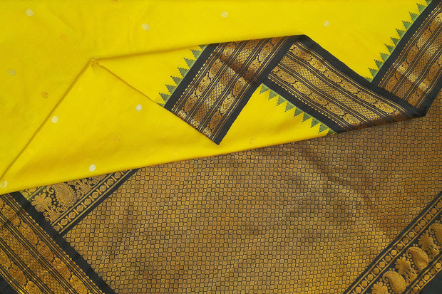 Gadwal pure silk saree in yellow  with gold & silver  motifs on the body
