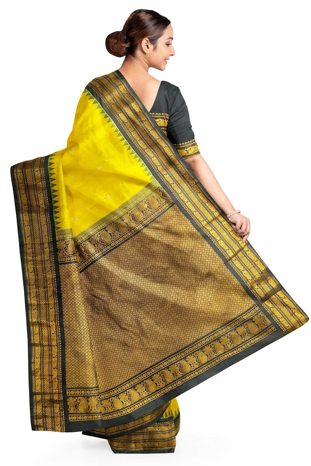 Gadwal pure silk saree in yellow  with gold & silver  motifs on the body