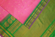 Handwoven Gadwal pure silk saree in pink  with gold & silver  motifs on the body