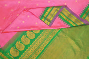 Handwoven Gadwal pure silk saree in pink  with gold & silver  motifs on the body