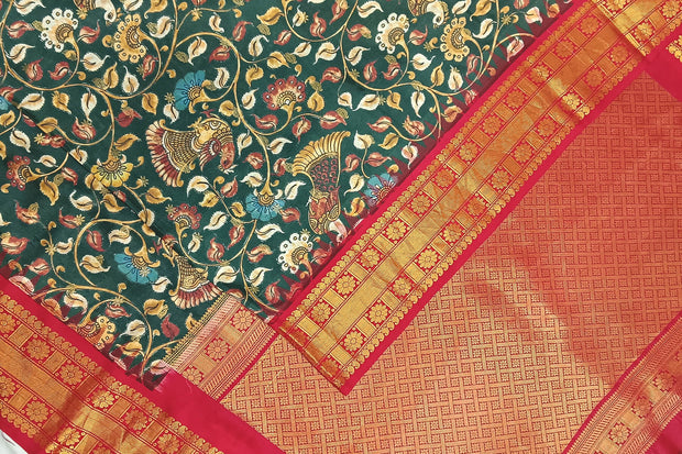 Gadwal pure silk  printed  kalamkari  dark green saree with floral & birds motifs .