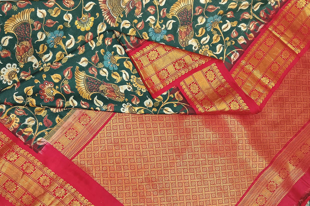 Gadwal pure silk  printed  kalamkari  dark green saree with floral & birds motifs .