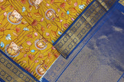 Gadwal pure silk printed pichwai design mustard saree with lotus vines & cows.