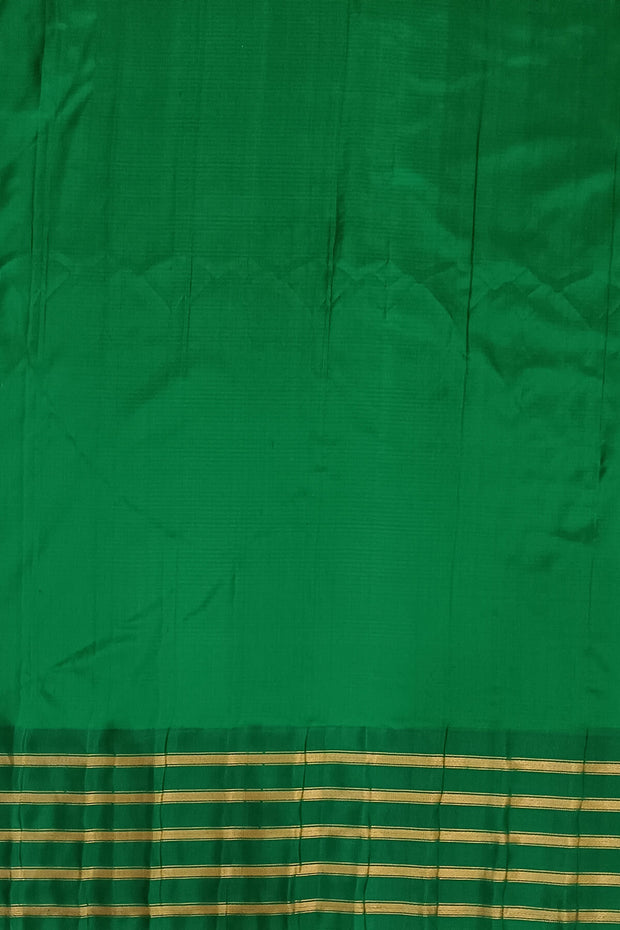 Handwoven Gadwal pure silk saree in mustard & black  in fine checks   and  a contrast pallu in green .