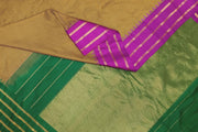 Handwoven Gadwal pure silk saree in mustard & black  in fine checks   and  a contrast pallu in green .