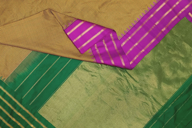 Handwoven Gadwal pure silk saree in mustard & black  in fine checks   and  a contrast pallu in green .