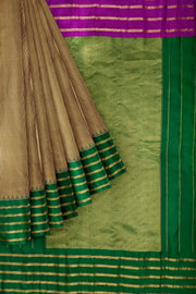 Handwoven Gadwal pure silk saree in mustard & black  in fine checks   and  a contrast pallu in green .