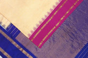 Handwoven Gadwal pure silk saree in cream & orange  in fine checks   and  a contrast pallu in blue .