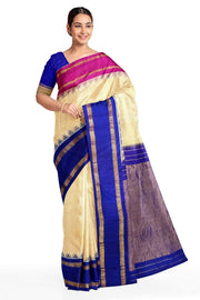 Handwoven Gadwal pure silk saree in cream & orange  in fine checks   and  a contrast pallu in blue .