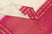 Handwoven Gadwal pure silk saree in cream  in fine checks   and  a contrast pallu in pink .
