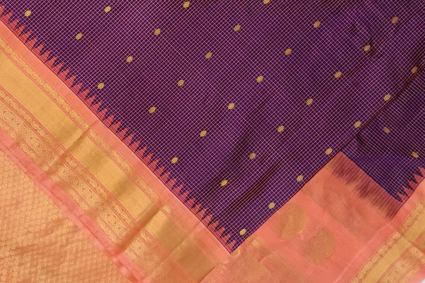 Handwoven Gadwal pure silk saree in wine in fine checks  with small motifs   and  a contrast pallu in peach .