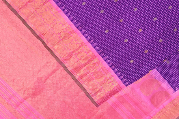 Handwoven Gadwal pure silk saree in violet in fine checks   with small motifs   and  a contrast pallu in baby pink