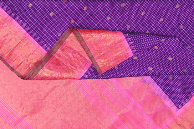 Handwoven Gadwal pure silk saree in violet in fine checks   with small motifs   and  a contrast pallu in baby pink