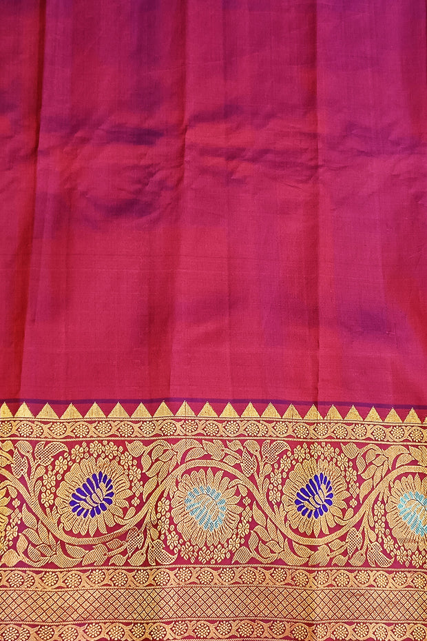 Handwoven Gadwal pure silk saree in pink with gold & silver motifs  all over the body.