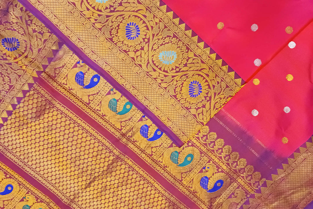 Handwoven Gadwal pure silk saree in pink with gold & silver motifs  all over the body.