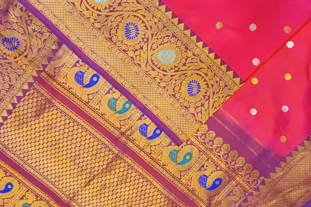 Handwoven Gadwal pure silk saree in pink with gold & silver motifs  all over the body.