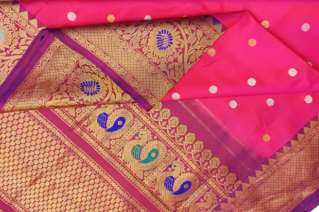 Handwoven Gadwal pure silk saree in pink with gold & silver motifs  all over the body.