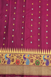 Handwoven Gadwal pure silk saree in bottle green with gold & silver motifs  all over the body.