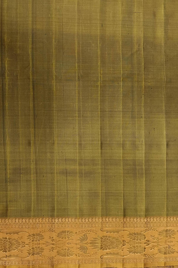 Handwoven Gadwal pure silk saree in bottle green with gold  motifs  all over the body.