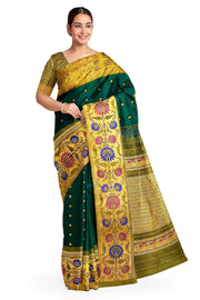 Handwoven Gadwal pure silk saree in bottle green with gold  motifs  all over the body.