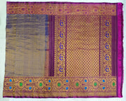 Handwoven Gadwal pure silk brocade saree in blue with rain drop motifs  all over the body.