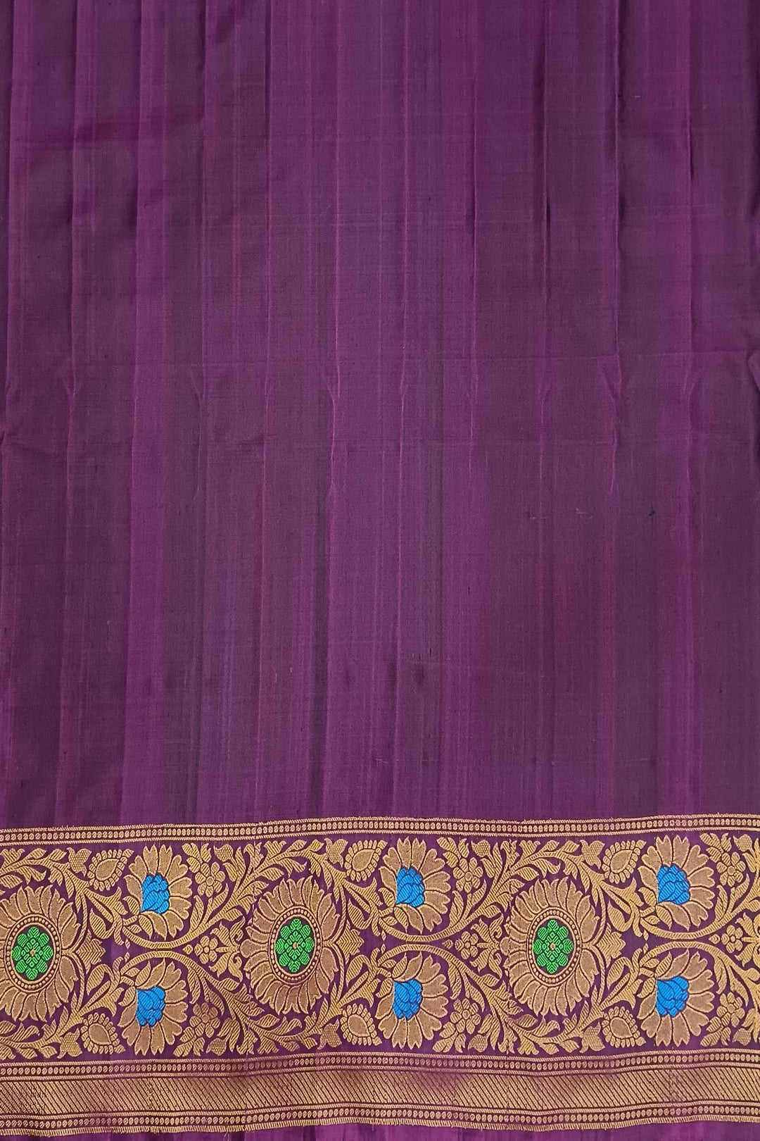 Handwoven Gadwal pure silk brocade saree in blue with rain drop motifs  all over the body.