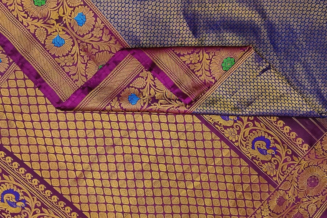 Handwoven Gadwal pure silk brocade saree in blue with rain drop motifs  all over the body.