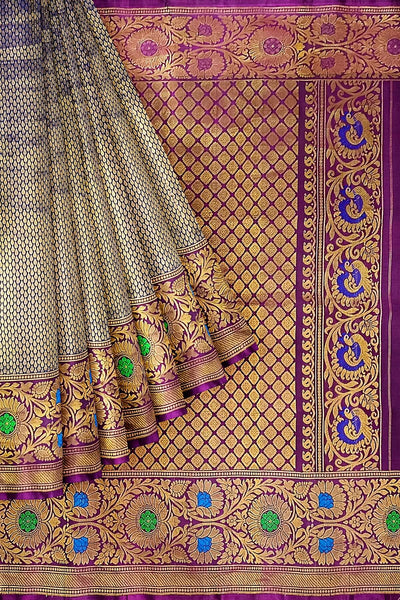 Handwoven Gadwal pure silk brocade saree in blue with rain drop motifs  all over the body.