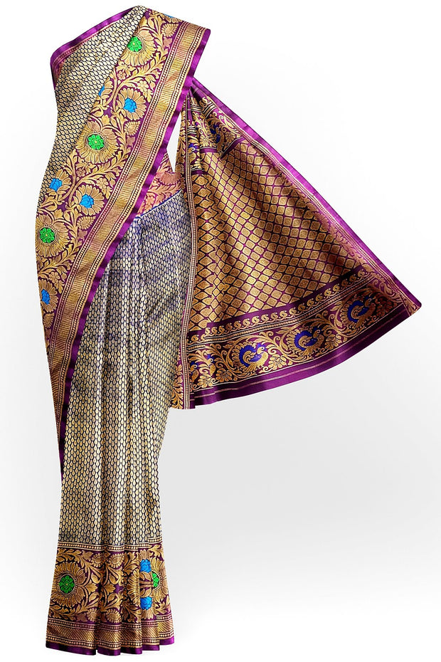 Handwoven Gadwal pure silk brocade saree in blue with rain drop motifs  all over the body.