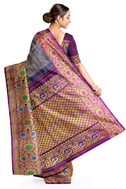 Handwoven Gadwal pure silk brocade saree in blue with rain drop motifs  all over the body.