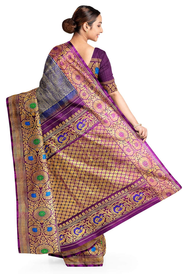 Handwoven Gadwal pure silk brocade saree in blue with rain drop motifs  all over the body.