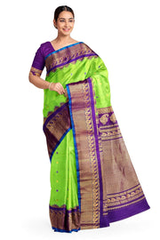 Handwoven Gadwal pure silk saree in green with floral motifs in gold & purple.