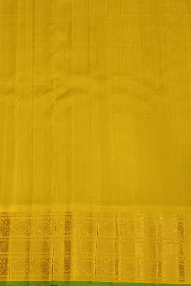 Handwoven Gadwal pure silk saree in purple with round motifs in gold & silver.