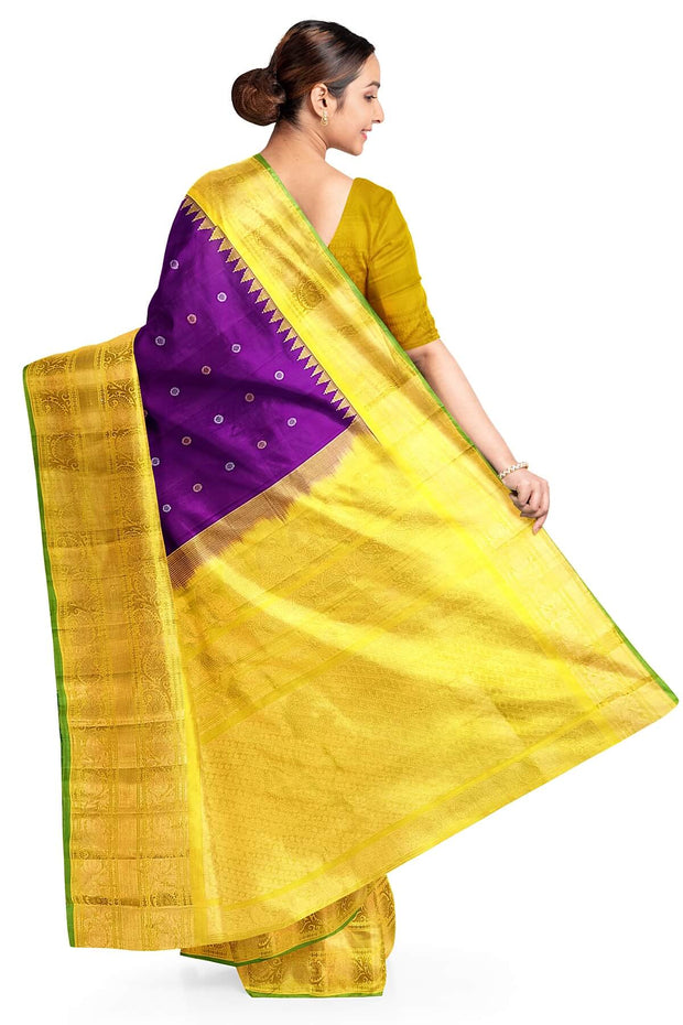 Handwoven Gadwal pure silk saree in purple with round motifs in gold & silver.