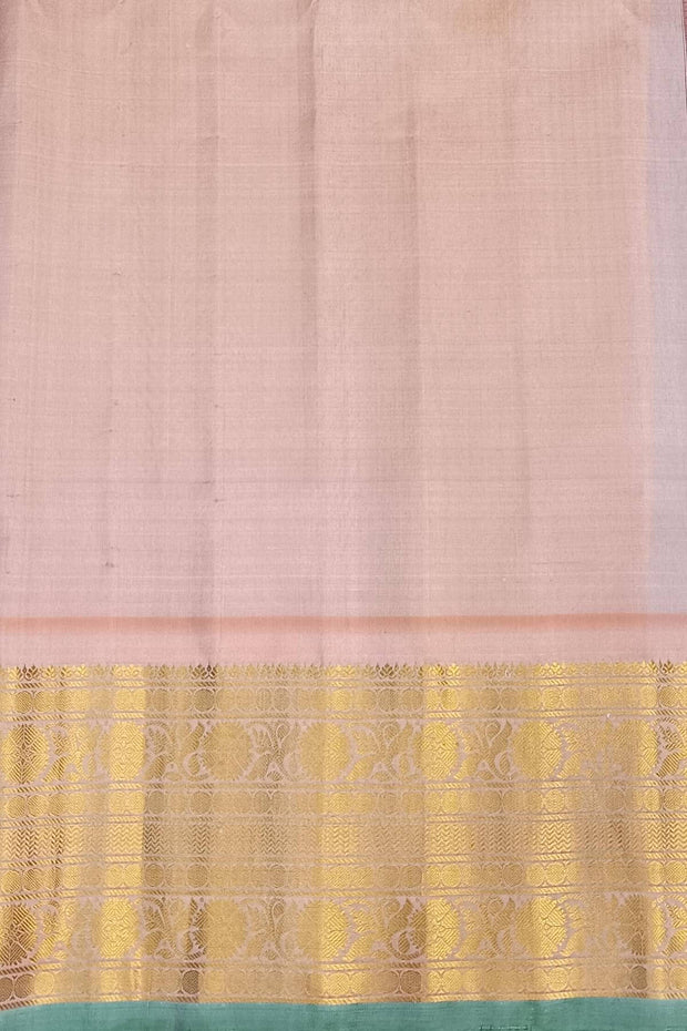 Handwoven Gadwal pure silk saree in purple with floral and paisley  motifs in gold & silver.