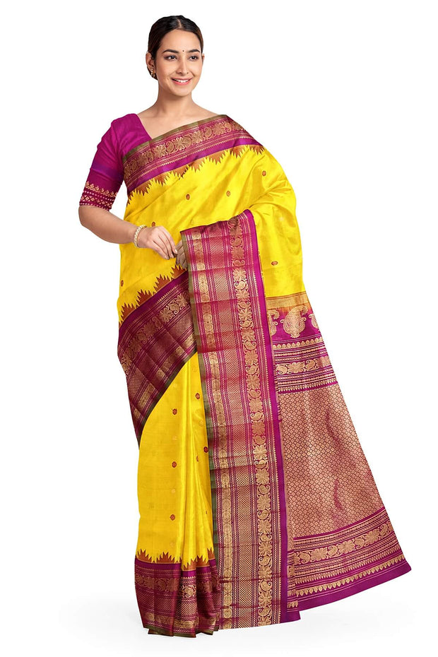 Handwoven Gadwal pure silk saree in yellow with floral   motifs in gold & magenta.