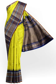 Handwoven Gadwal pure silk saree in lemon green with floral   motifs in gold & silver.