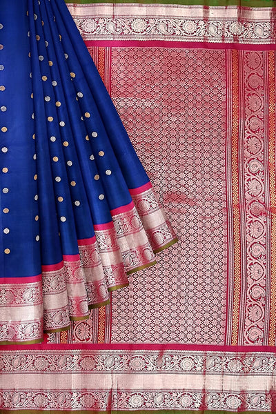 Handwoven Gadwal pure silk saree in peacock blue with floral and paisley  motifs in gold & silver.