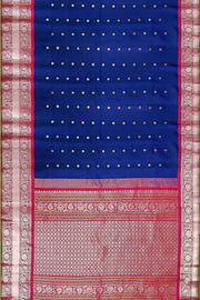 Handwoven Gadwal pure silk saree in peacock blue with floral and paisley  motifs in gold & silver.