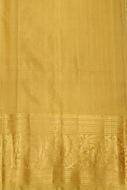 Handwoven Gadwal pure silk saree in purple with floral  motifs in gold .