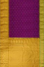 Handwoven Gadwal pure silk saree in purple with floral  motifs in gold .