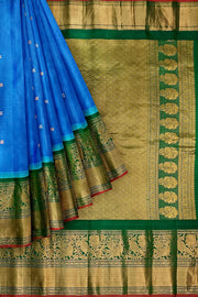 Gadwal pure silk saree in blue with peacock motifs in gold & silver.