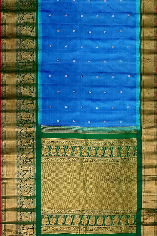 Gadwal pure silk saree in blue with peacock motifs in gold & silver.